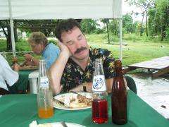 Steve is dozing at the lunch table before heading downriver in Belize.